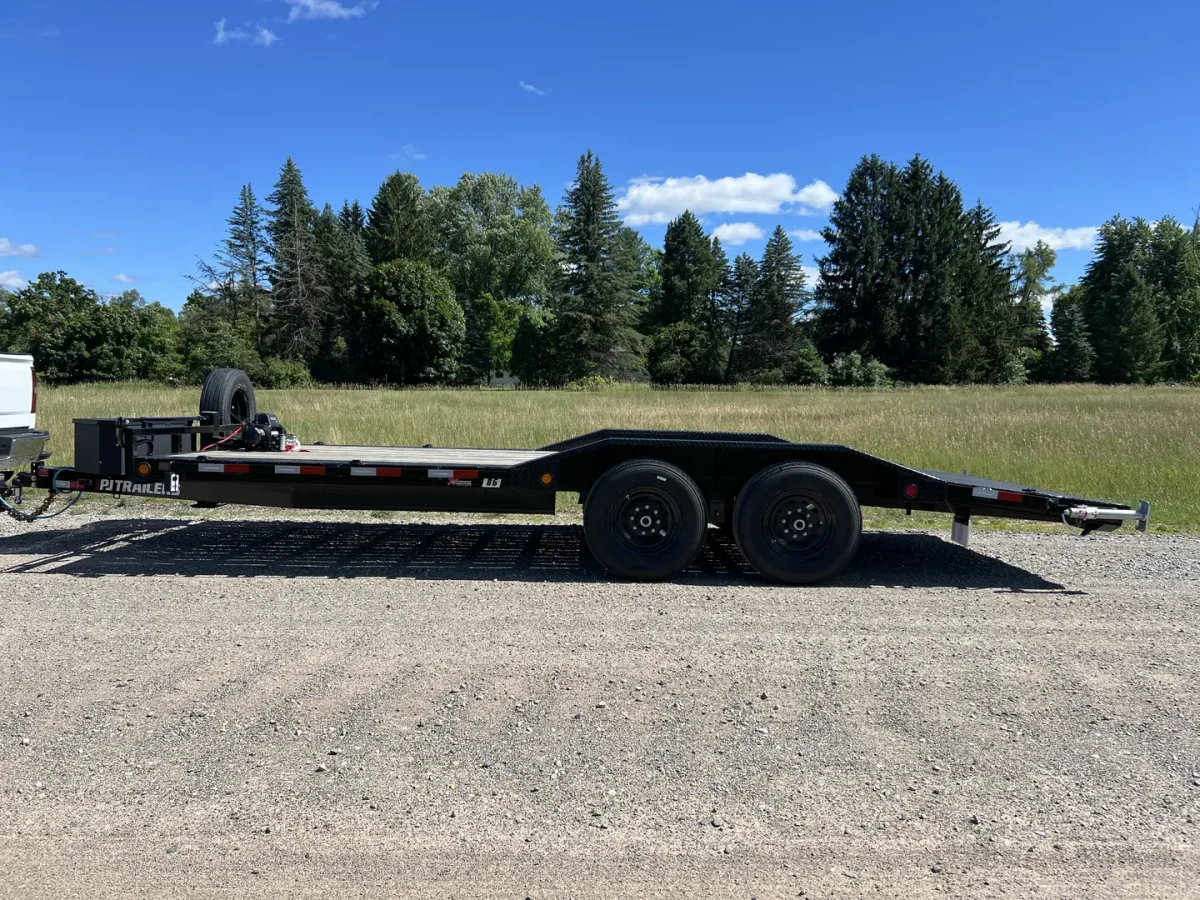 Full side view of JH Trailer Rental’s 20-foot PJ car hauler in Newaygo
